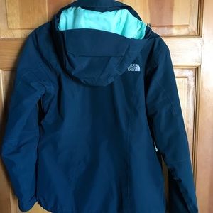 A dark teal winter North Face Jacket
